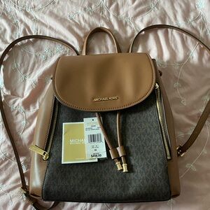 new my daughter took the tag off. It was never used stored in my closet.